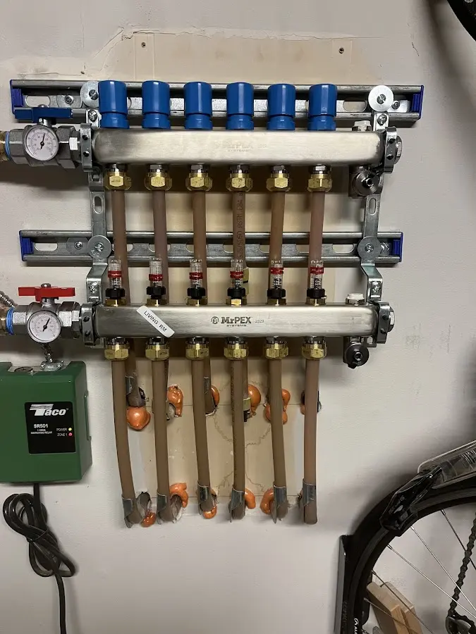 Plumber performing Water Heater Repair at a residential property in Katy